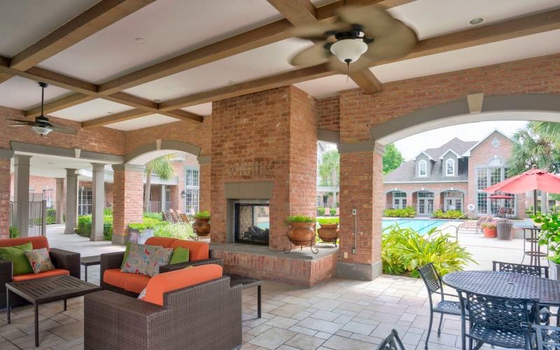 covered, outdoor patio with fireplace